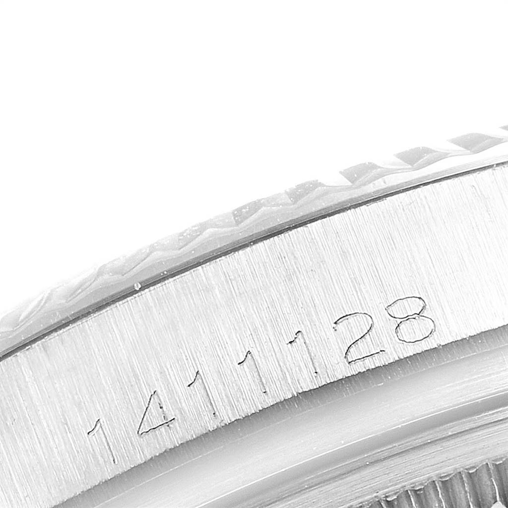 Close-up of the side of a Rolex Vintage Collection 1601 Men
s Stainless Steel Silver Dial 1601 Men
s Stainless Steel Silver Dial watch, showing the case and serial number engraving (1411128).