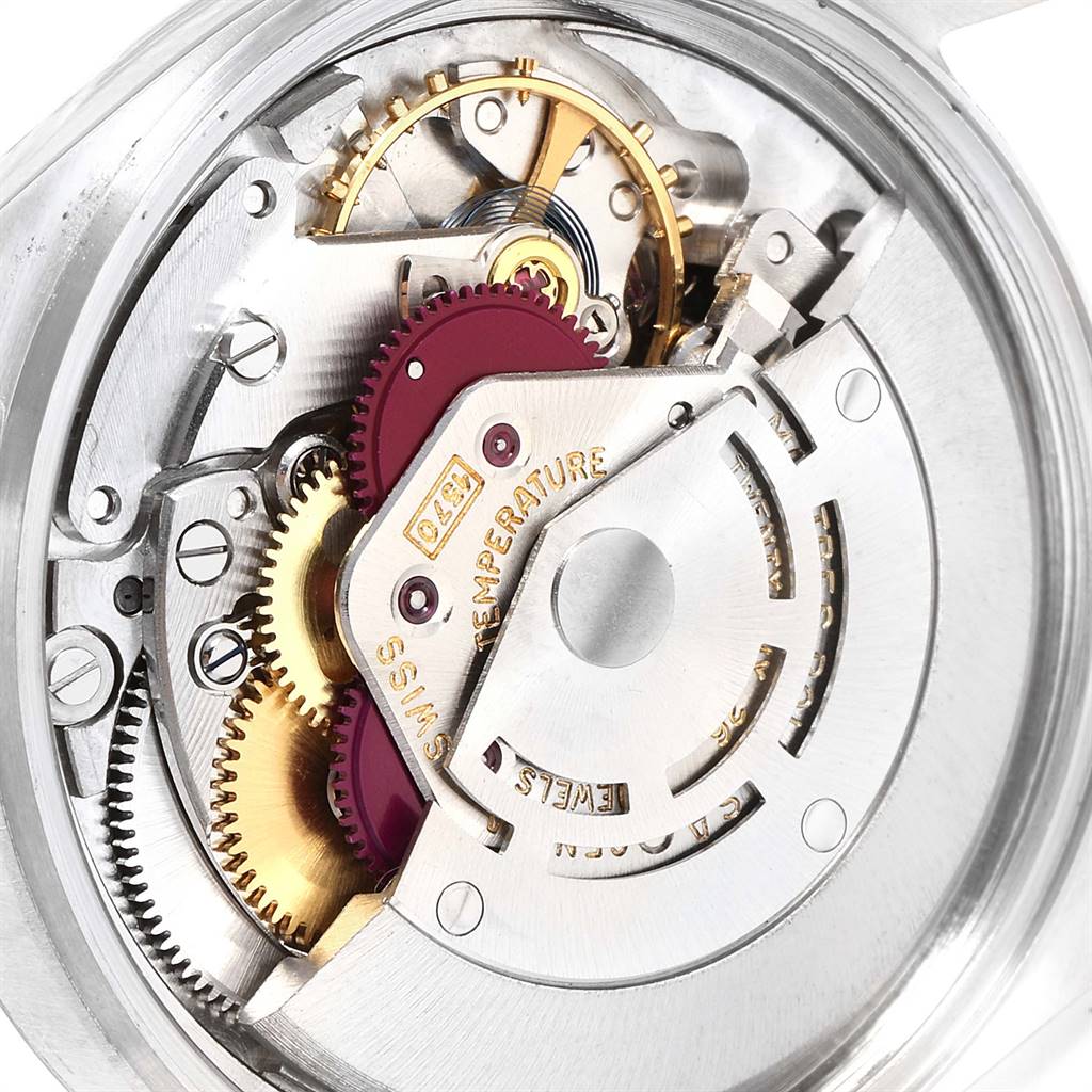 Close-up of the internal mechanism of a Rolex Vintage Collection 1601 Men
s Stainless Steel Silver Dial 1601 Men
s Stainless Steel Silver Dial model, showing gears and intricate movements.
