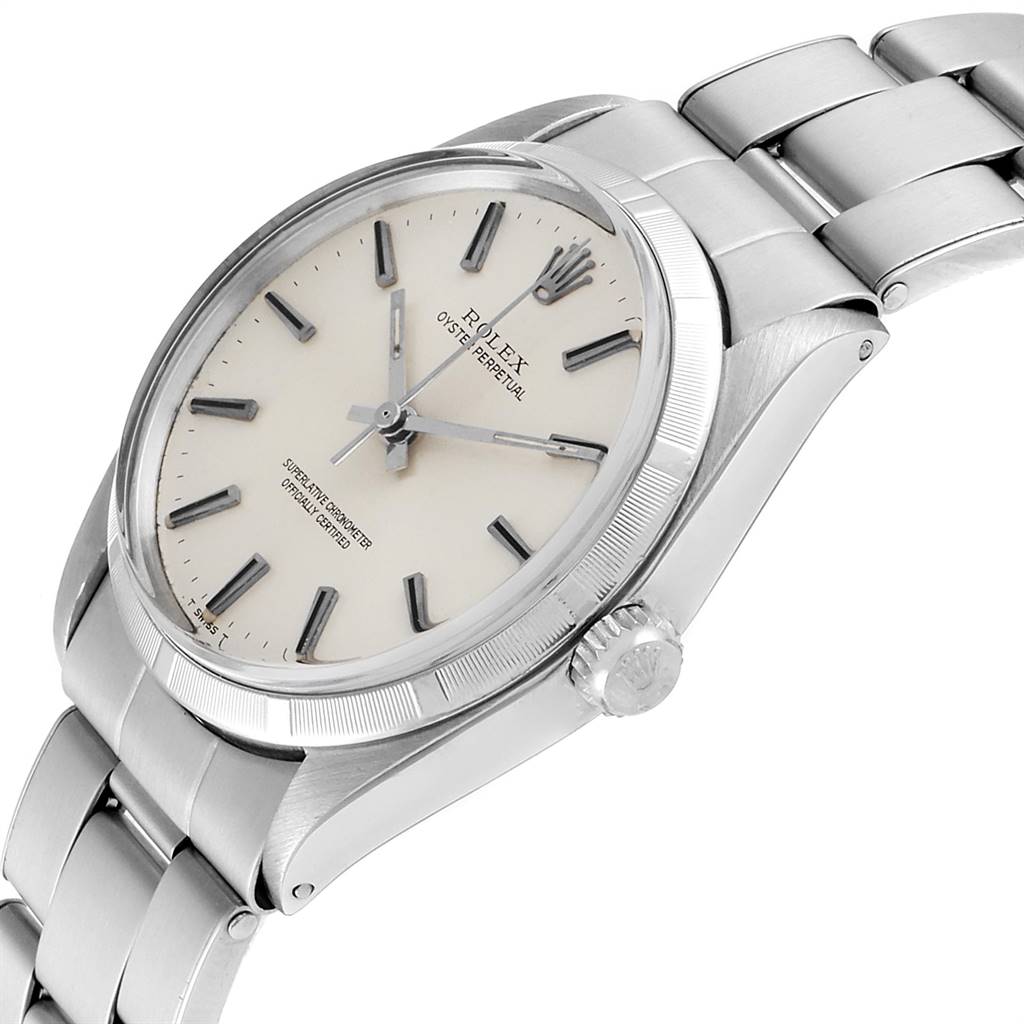 The image shows a side angle of the Rolex Vintage Collection 1003 Men
s Stainless Steel Silver Dial 1003 Men
s Stainless Steel Silver Dial watch, including the face, bezel, crown, and part of the metal bracelet.