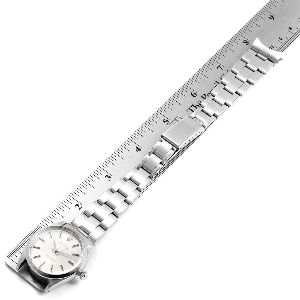 The Rolex Vintage Collection 1003 Men
s Stainless Steel Silver Dial 1003 Men
s Stainless Steel Silver Dial watch is shown flat with face, bracelet, and clasp visible, alongside a ruler for measurement.