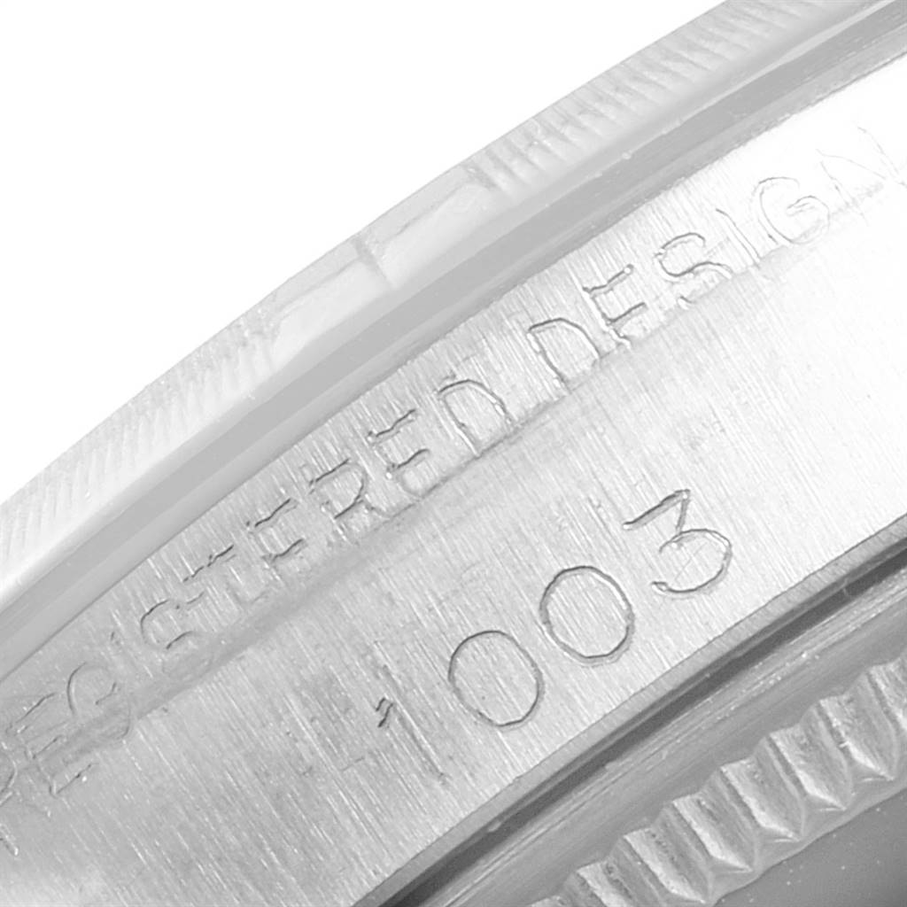 This image shows a close-up of the engraved bezel and case of the Rolex Vintage Collection 1003 Men
s Stainless Steel Silver Dial 1003 Men
s Stainless Steel Silver Dial model.