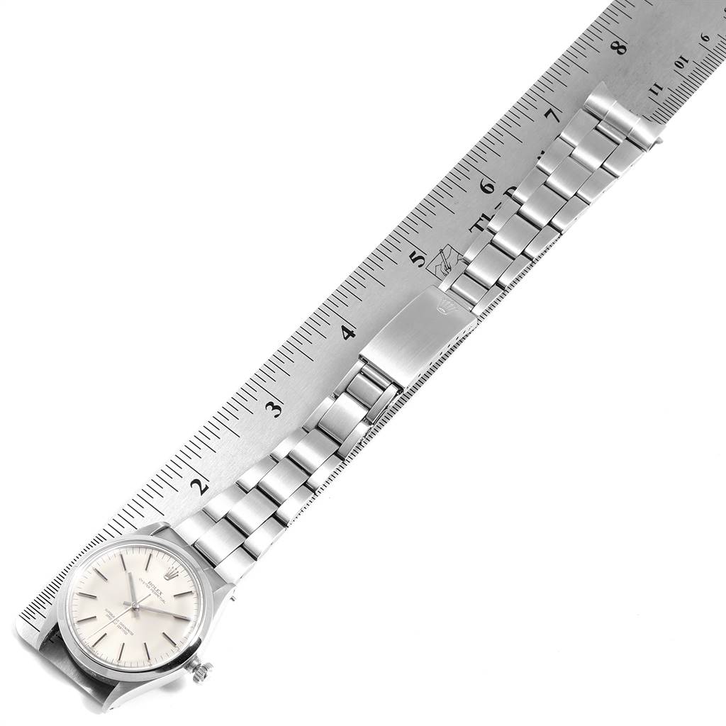 The image shows the stainless steel band and clasp of a Vintage Collection Rolex watch, with a ruler measuring its length.