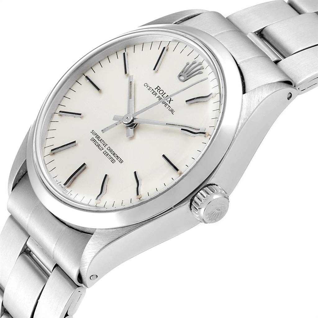 The image shows a close-up, angled view of the face and side crown of a Rolex Vintage Collection 1002 Men
s Stainless Steel Silver Dial 1002 Men
s Stainless Steel Silver Dial watch.