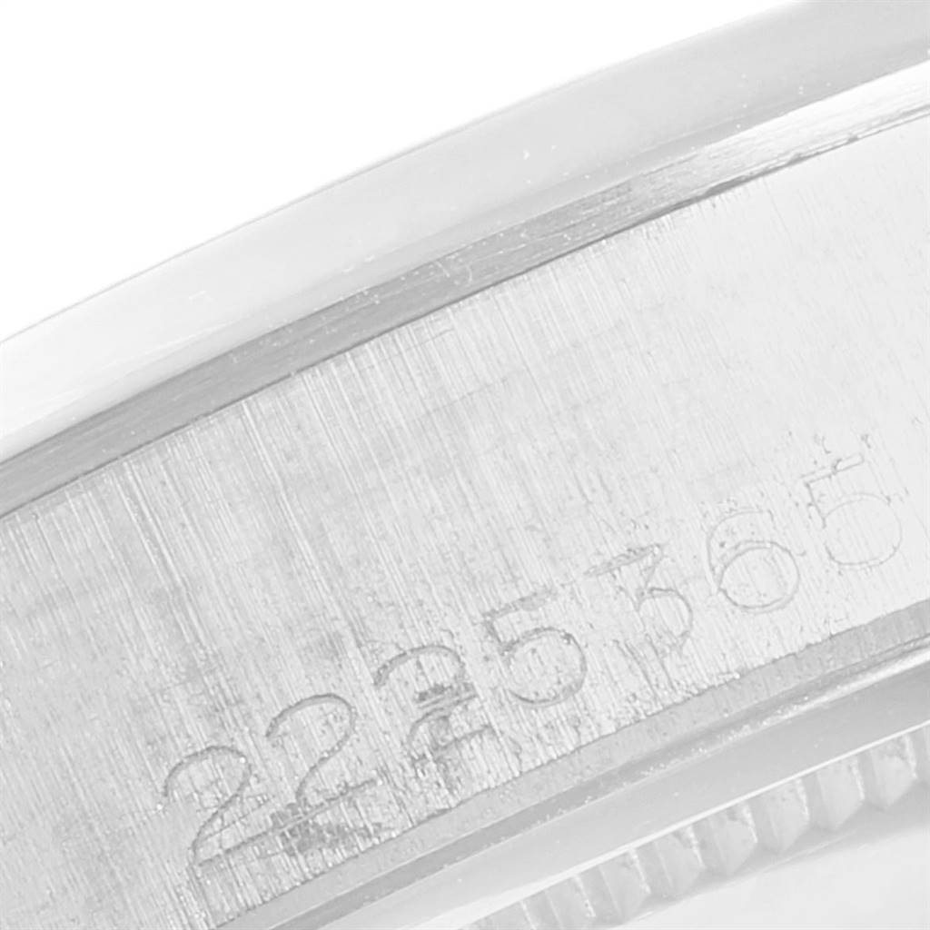 This image shows a close-up of the serial number engraving on the side of a Rolex Vintage Collection 6694 Men's Stainless Steel Black Dial 6694 Men's Stainless Steel Black Dial watch case.