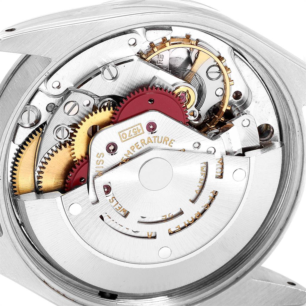 This is a close-up image showing the intricate internal gears and mechanism of a Vintage Collection Rolex watch.