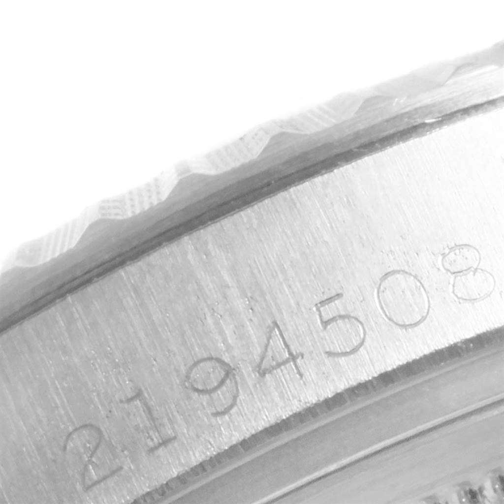 The close-up image shows the engraved serial number on the side case of the Rolex Vintage Collection 1601 Men
s Stainless Steel Silver Dial 1601 Men
s Stainless Steel Silver Dial watch.