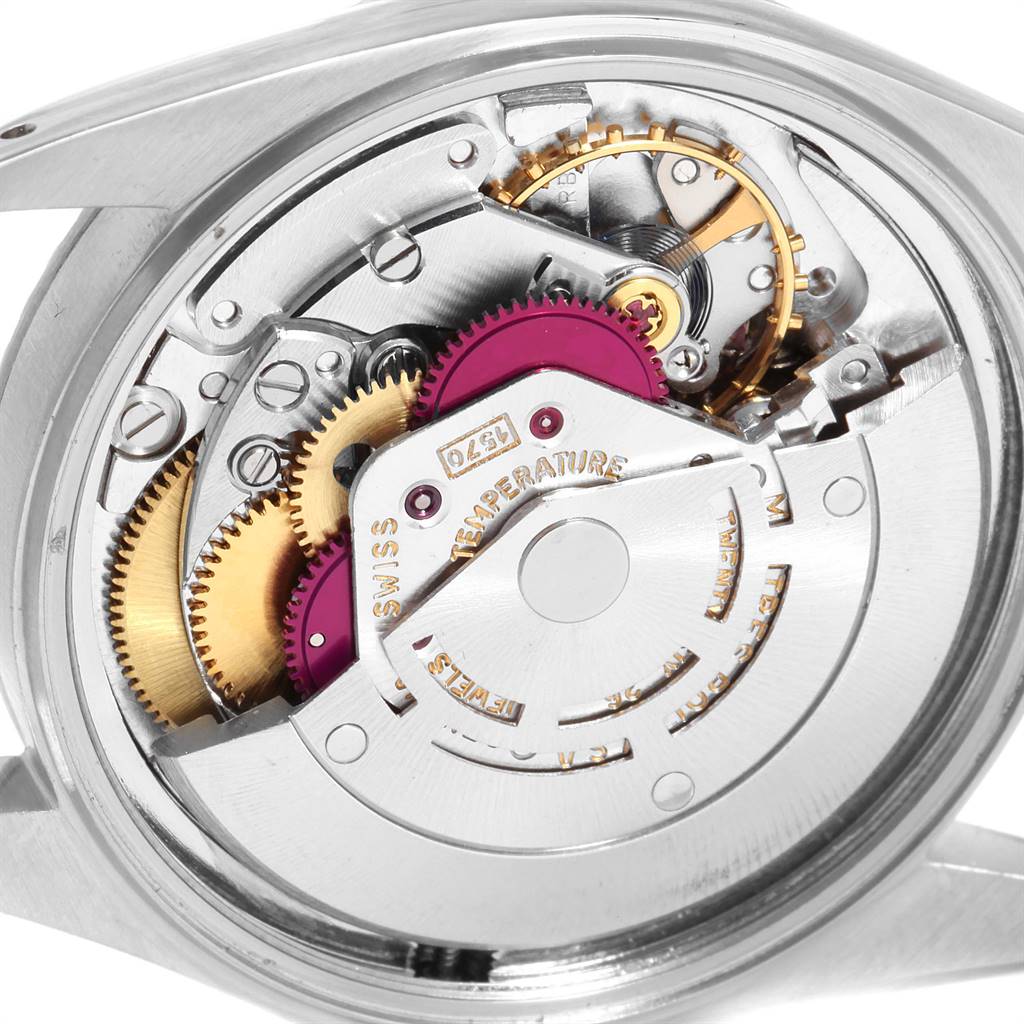 This image shows the intricate internal mechanisms of the Rolex Vintage Collection 1601 Men
s Stainless Steel Silver Dial 1601 Men
s Stainless Steel Silver Dial watch from an open-case back angle.