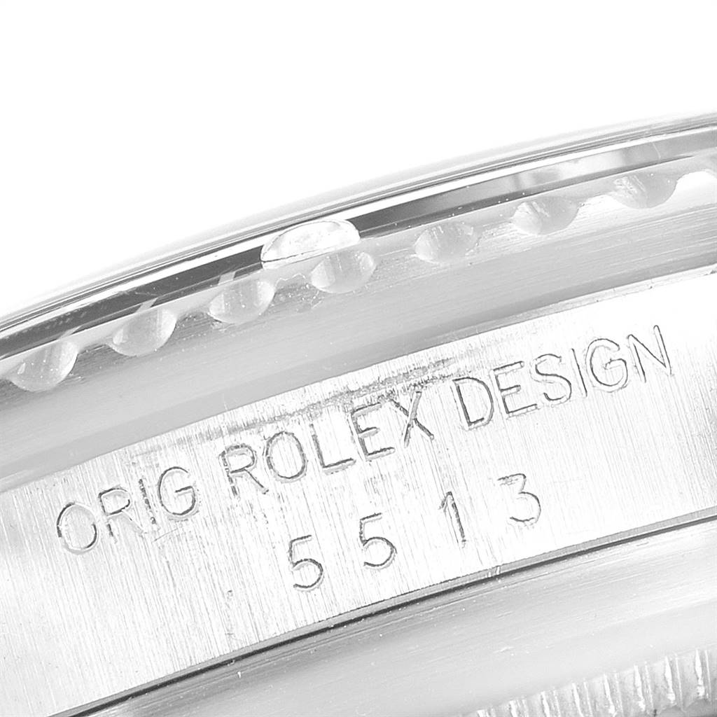 This close-up image shows the engraved case side of the Rolex Vintage Collection 5513 Men
s Stainless Steel Black Dial 5513 Men
s Stainless Steel Black Dial model 5513, displaying "ORIG ROLEX DESIGN".