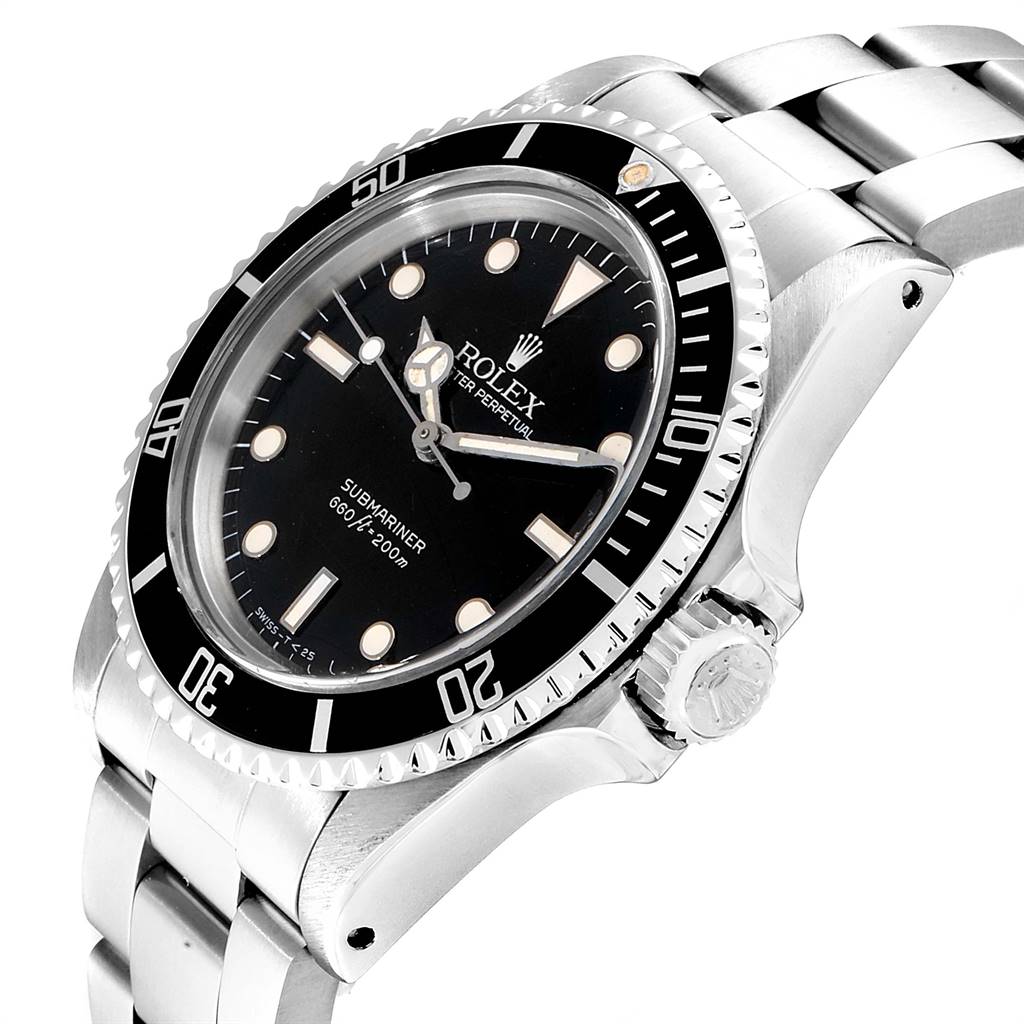 The image shows a Vintage Collection Rolex Submariner watch from an angled side view highlighting the dial, bezel, and part of the bracelet.