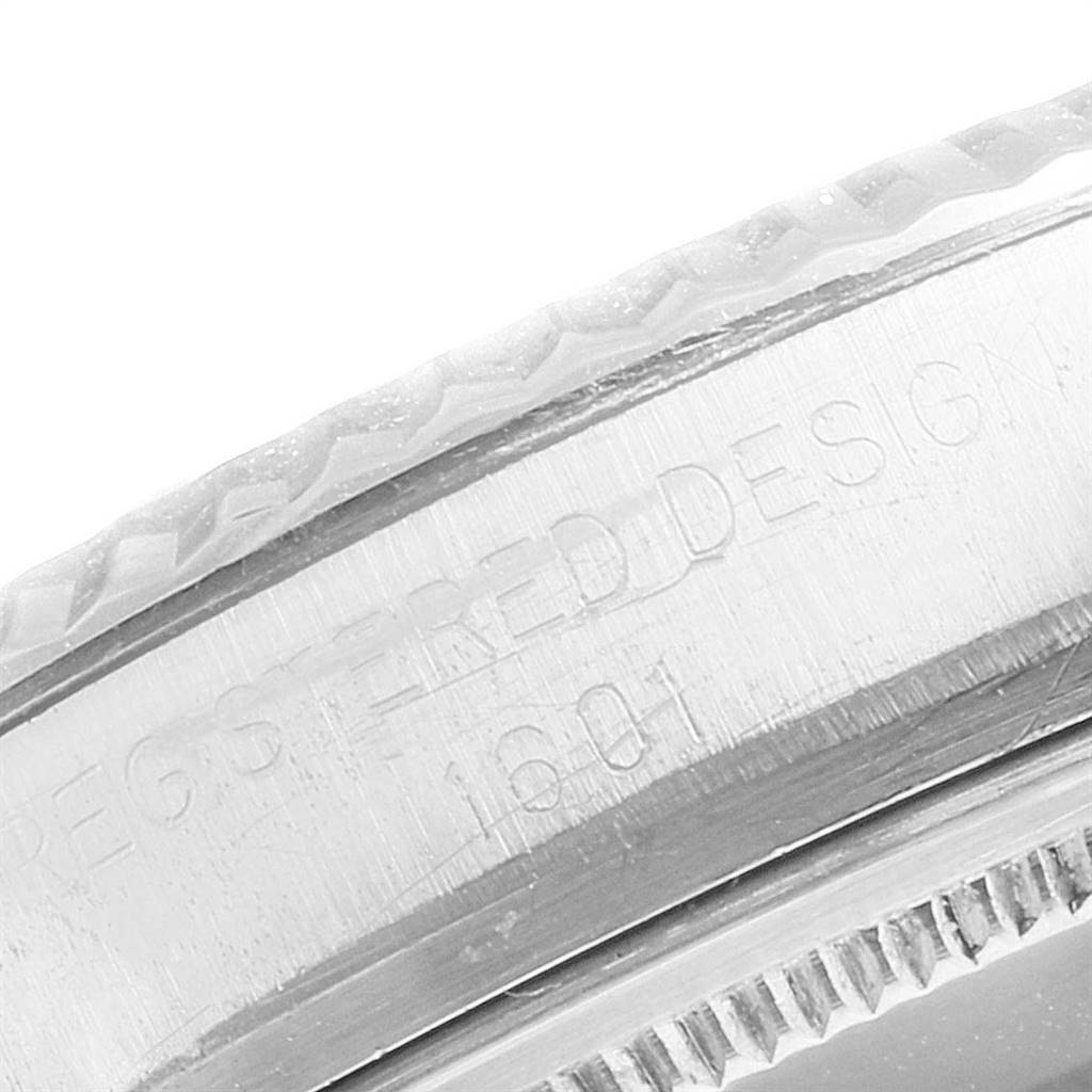 This close-up shows part of the bezel and case of the Rolex Vintage Collection 1601 Men
s Stainless Steel Silver Dial 1601 Men
s Stainless Steel Silver Dial model.