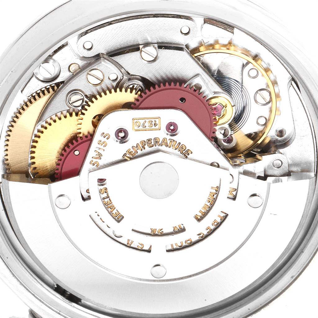 This image shows an inside view of the Rolex Vintage Collection 1500 Men
s Stainless Steel Silver Dial 1500 Men
s Stainless Steel Silver Dial watch movement, featuring gears and inscriptions.