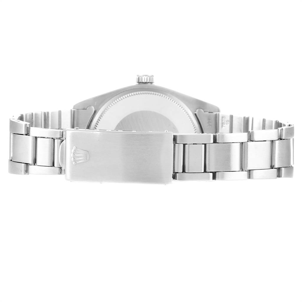 The image shows the back view of the Rolex Vintage Collection 1500 Men
s Stainless Steel Silver Dial 1500 Men
s Stainless Steel Silver Dial watch, focusing on its closed metal bracelet and clasp.