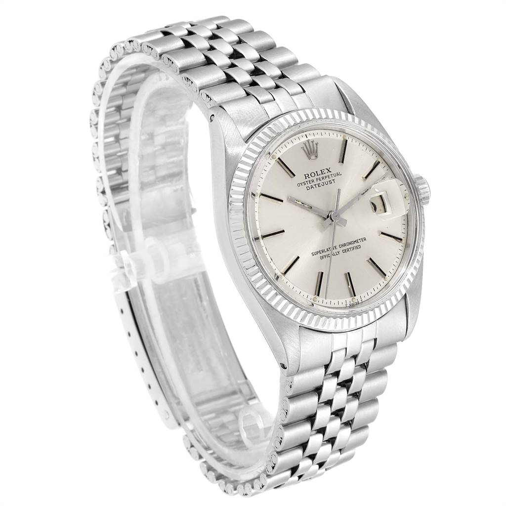 The image showcases a Rolex Vintage Collection 1601 Men
s Stainless Steel Silver Dial 1601 Men
s Stainless Steel Silver Dial watch with a silver strap, fluted bezel, and a white dial, angled for a side view.