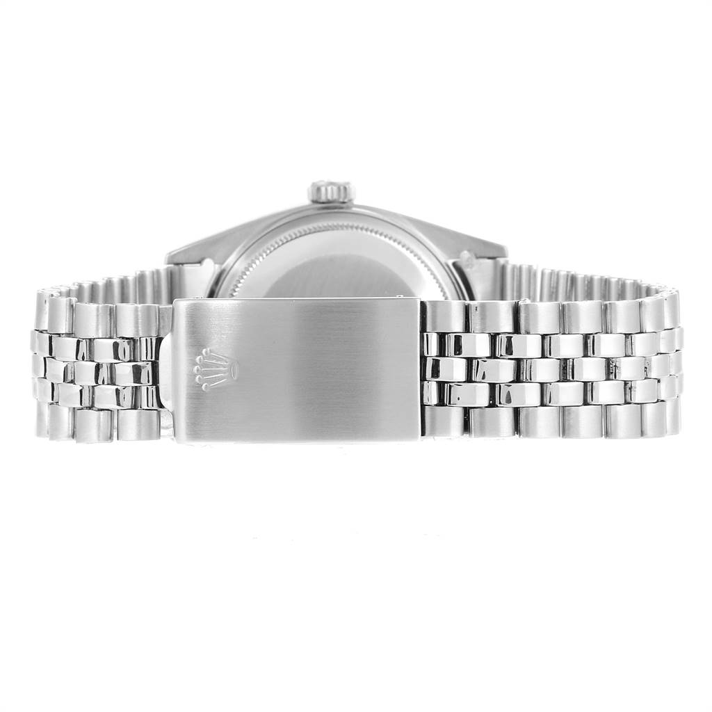 The image shows the back view of a Rolex Vintage Collection 1601 Men
s Stainless Steel Silver Dial 1601 Men
s Stainless Steel Silver Dial watch, focusing on the caseback and the stainless steel bracelet clasp.