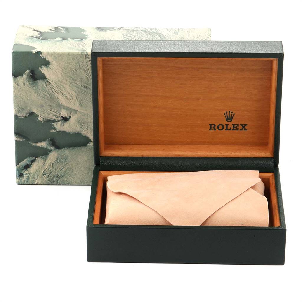 The image shows the open, empty box and soft cover for a Vintage Collection watch by Rolex, with the outer packaging in the background.