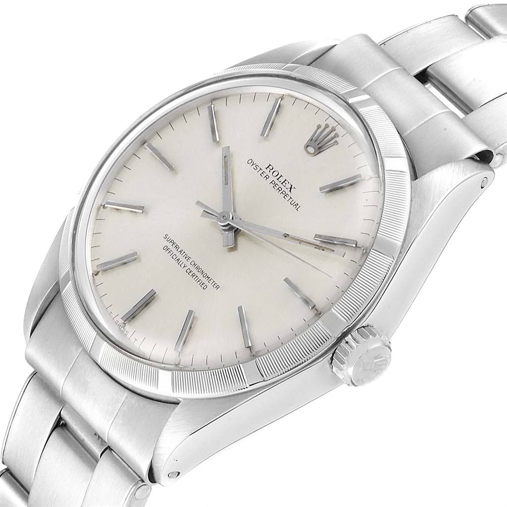 The Rolex Vintage Collection 1003 Men
s Stainless Steel Silver Dial 1003 Men
s Stainless Steel Silver Dial watch is shown at a slight angled close-up, displaying the dial, hour markers, hands, crown, and part of the band.