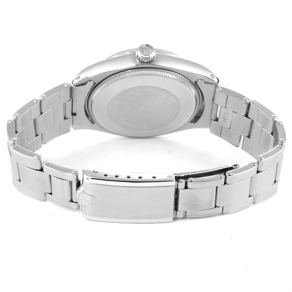 The image shows the back side of a Rolex Vintage Collection 1003 Men
s Stainless Steel Silver Dial 1003 Men
s Stainless Steel Silver Dial watch, highlighting the case back, crown, and metal bracelet.