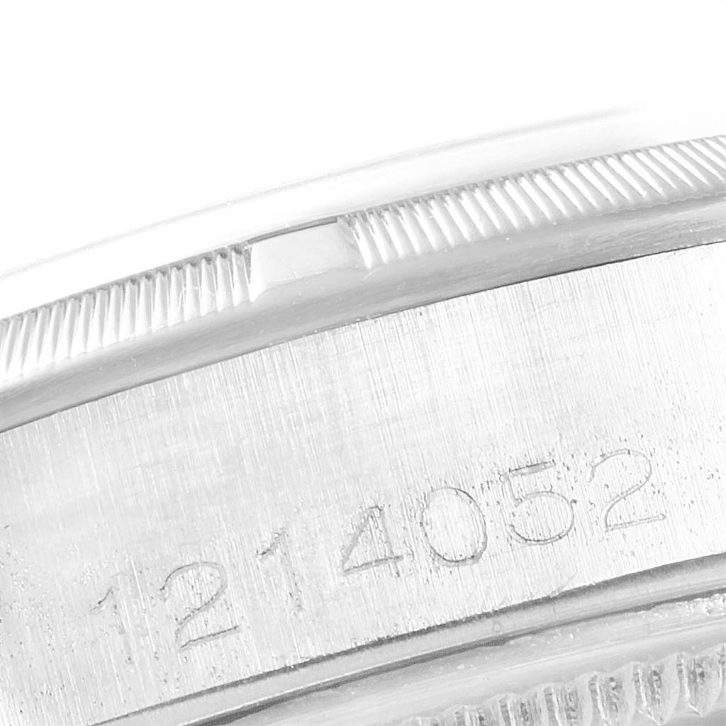 The image shows a close-up view of the side casing with engraved serial numbers on a Vintage Collection model by Rolex.