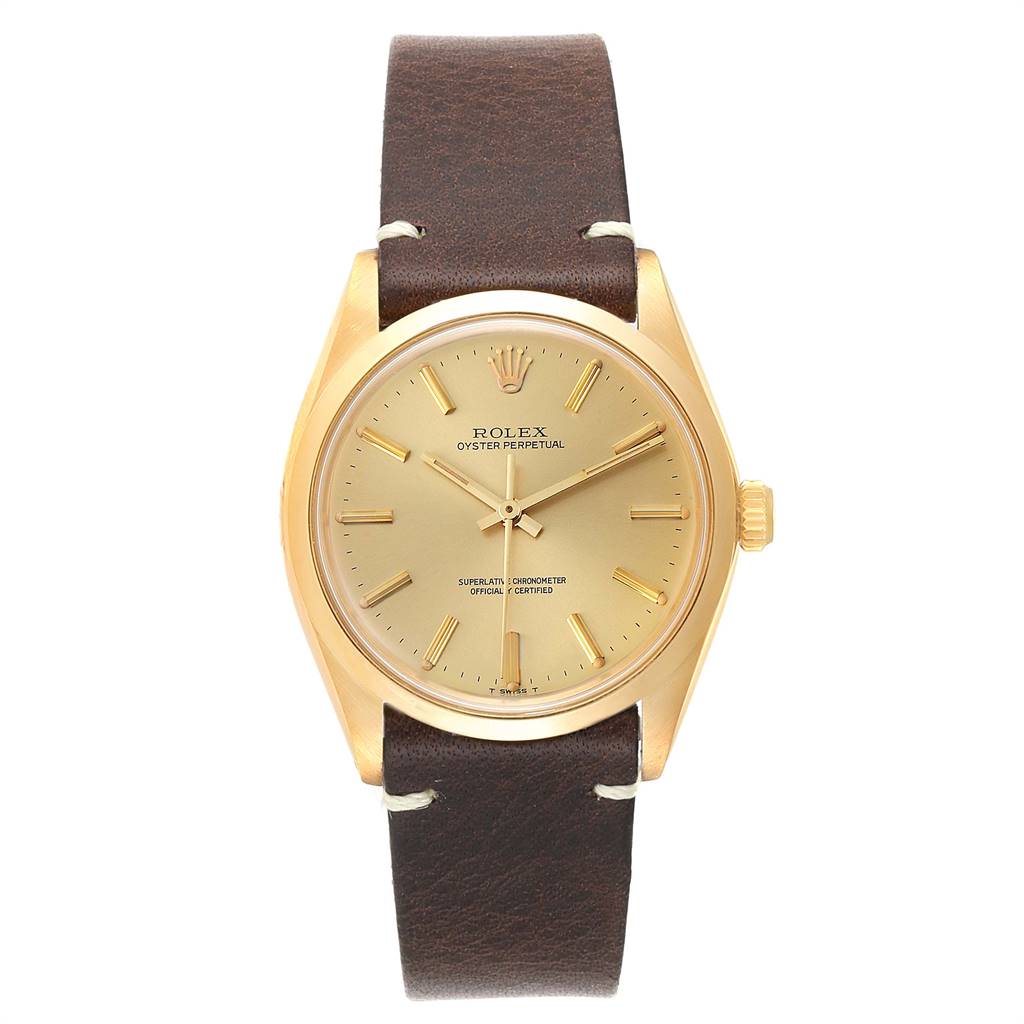 This image shows a front view of a Rolex Vintage Collection 1002 Men
s Yellow Gold Champagne Dial 1002 Men
s Yellow Gold Champagne Dial Oyster Perpetual watch with a brown leather strap and gold casing.