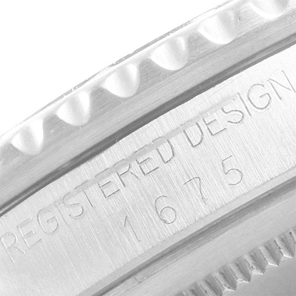 The image shows a close-up of the serial number engraving on the case of a Rolex Vintage Collection 1675 Men
s Stainless Steel Black Dial 1675 Men
s Stainless Steel Black Dial model 1675.