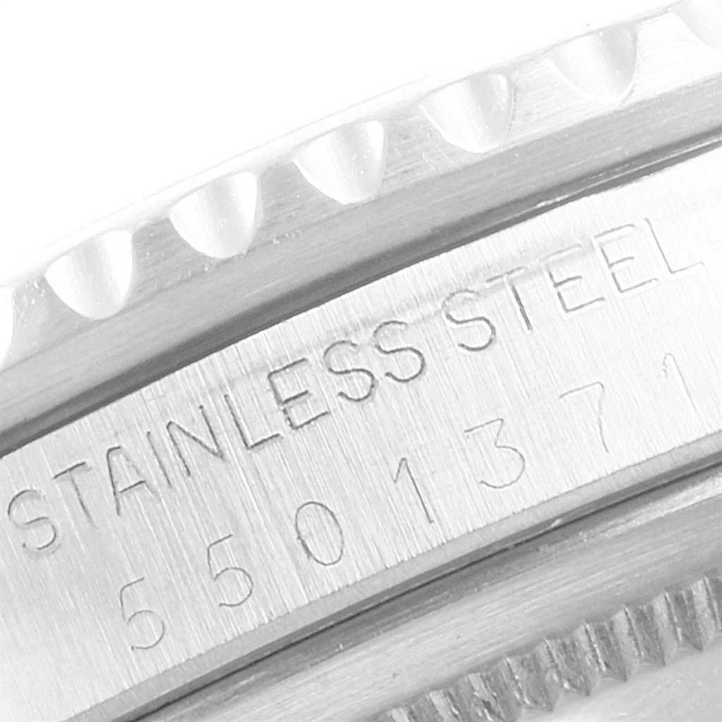 This image shows a close-up of the stainless steel bezel and serial number engraving on the Rolex Vintage Collection 1675 Men
s Stainless Steel Black Dial 1675 Men
s Stainless Steel Black Dial model.