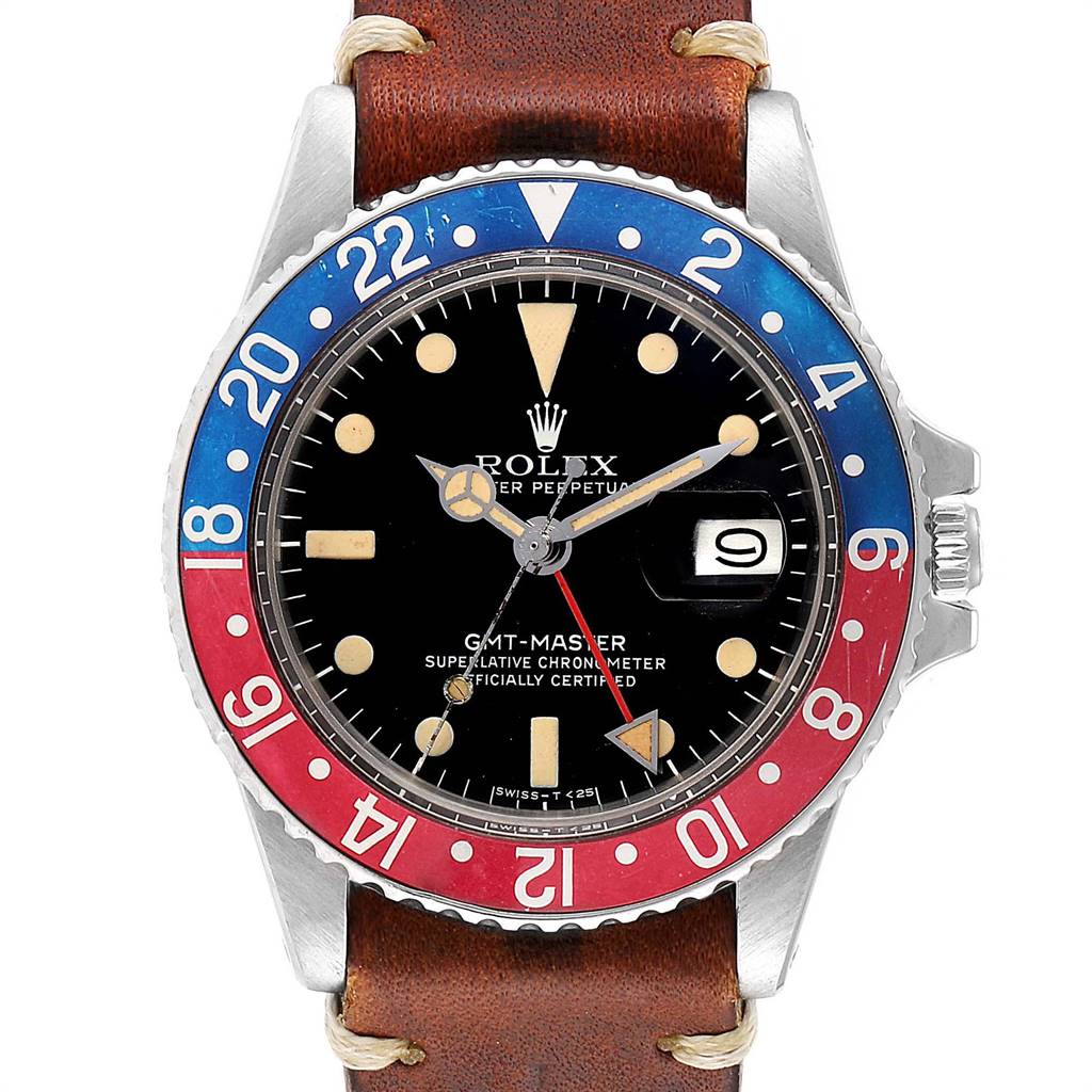 The watch shown is a Rolex Vintage Collection 1675 Men
s Stainless Steel Black Dial 1675 Men
s Stainless Steel Black Dial GMT-Master, viewed from the front, featuring a red and blue bezel and a brown leather strap.