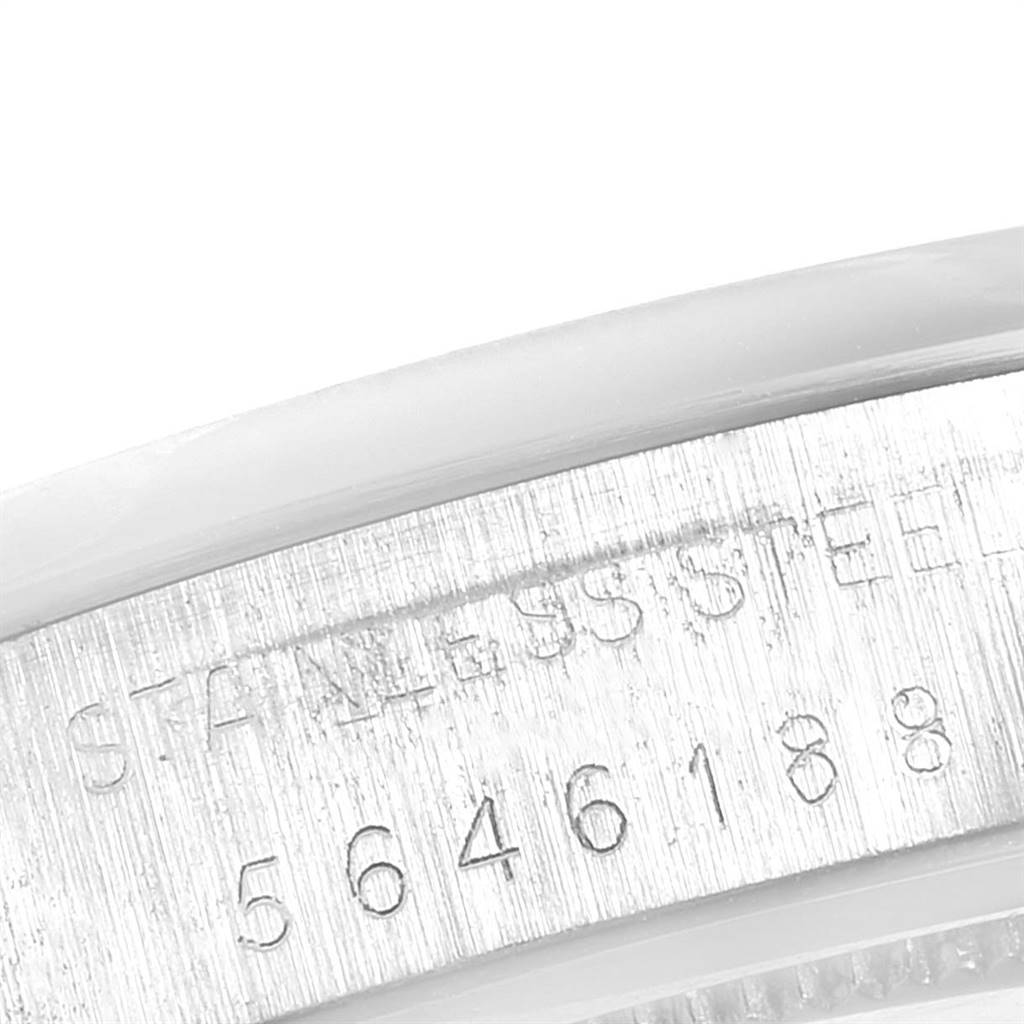 The image shows a close-up of the serial number engraving on the stainless steel casing of the Rolex Vintage Collection 6694 Men's Stainless Steel Silver Dial 6694 Men's Stainless Steel Silver Dial watch.