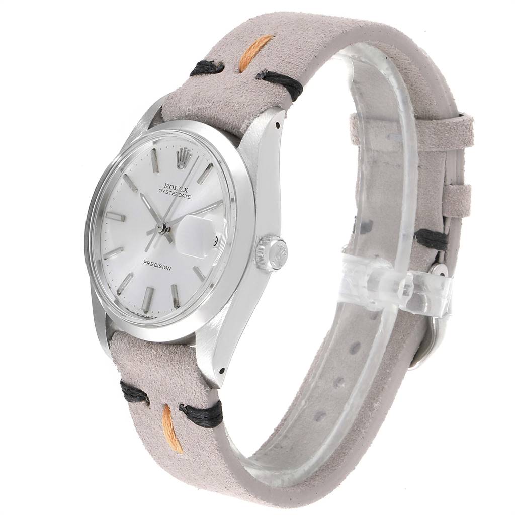 The Rolex Vintage Collection 6694 Men's Stainless Steel Silver Dial 6694 Men's Stainless Steel Silver Dial model is shown at an oblique angle, displaying its face, crown, and suede strap.