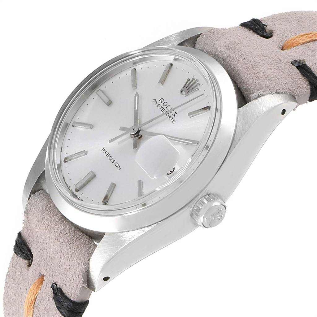 This image shows a side angle of the Rolex Vintage Collection 6694 Men's Stainless Steel Silver Dial 6694 Men's Stainless Steel Silver Dial watch, highlighting the dial, case, crown, and part of the strap.