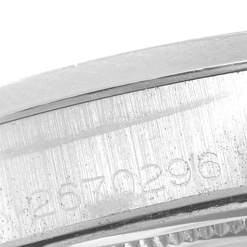This image shows a close-up of the engraved serial number on the case of a Rolex Vintage Collection 6694 Men
s Stainless Steel Silver Dial 6694 Men
s Stainless Steel Silver Dial watch.