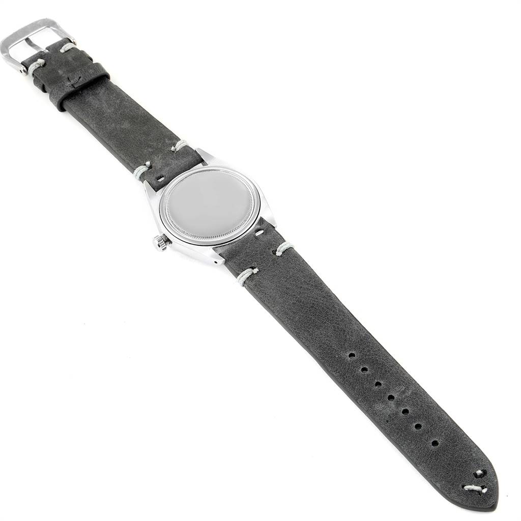 This image shows a top-down view of a Vintage Collection Rolex watch, highlighting its strap, dial, and casing.