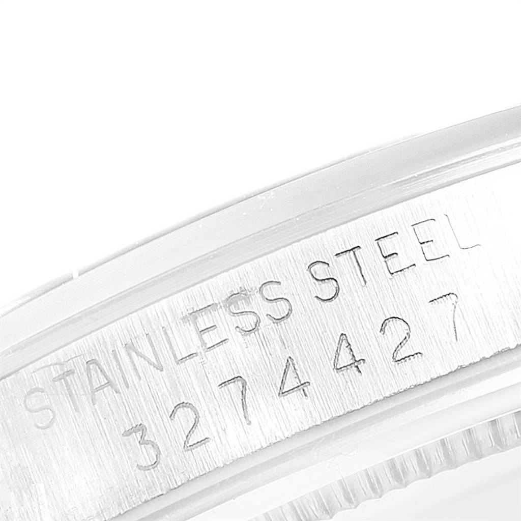 This image shows a close-up of the engraved serial number and material information on the side of the Rolex Vintage Collection 6426 Men
s Stainless Steel Silver Dial 6426 Men
s Stainless Steel Silver Dial watch case.