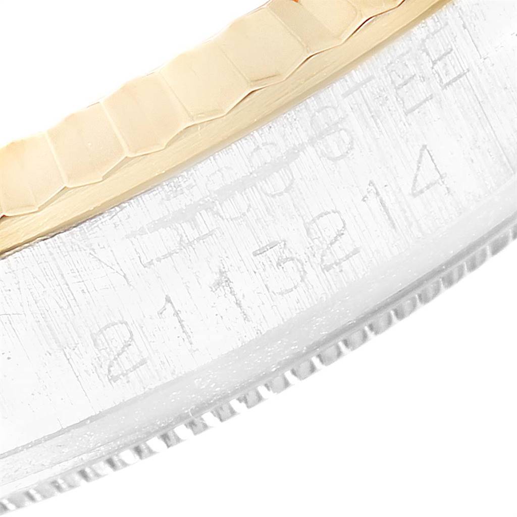 This image shows a close-up view of the engraved serial number and edge of the bezel on a Rolex Vintage Collection 1601 Men
s Stainless Steel Silver Dial 1601 Men
s Stainless Steel Silver Dial watch.