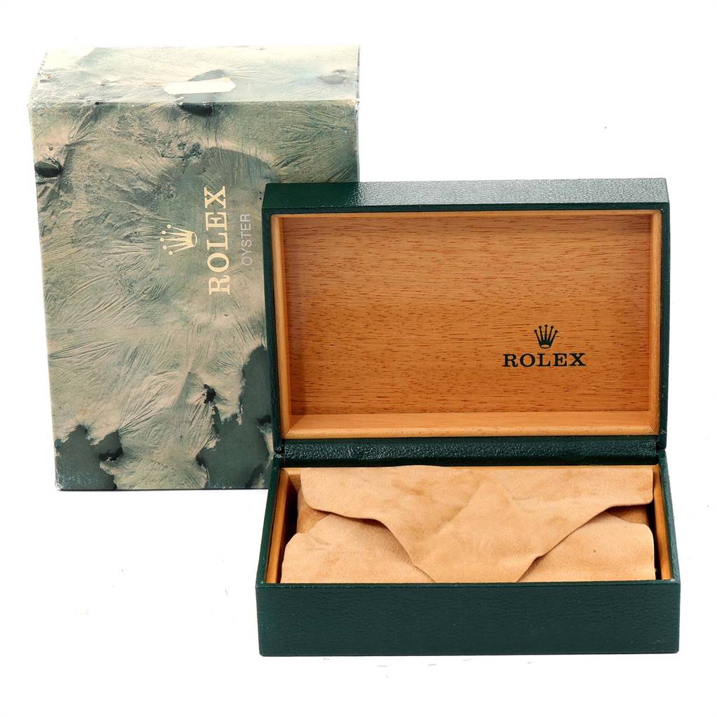 The image shows an open Rolex Vintage Collection 1601 Men
s Stainless Steel Silver Dial 1601 Men
s Stainless Steel Silver Dial watch box with its lid up, revealing the interior and packaging material.