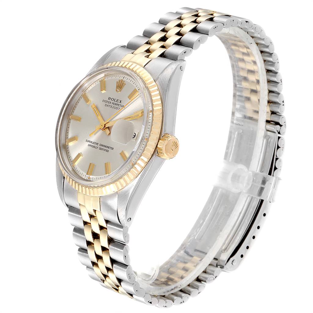 The image shows a side angle view of the Rolex Vintage Collection 1601 Men
s Stainless Steel Silver Dial 1601 Men
s Stainless Steel Silver Dial watch, showcasing its stainless steel and gold bracelet, bezel, and dial.