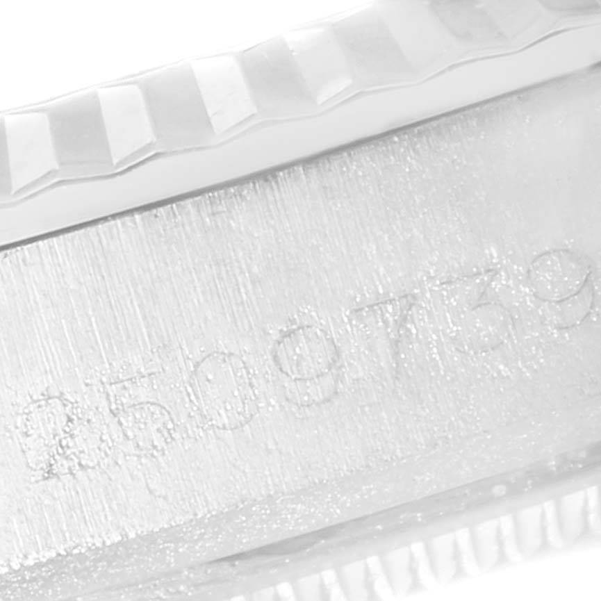 The image shows a close-up of the serial number and part of the bezel of the Vintage Collection Rolex watch.