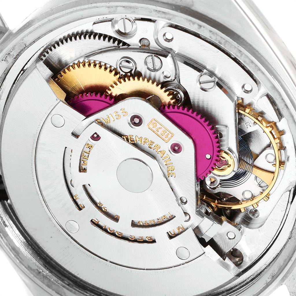 This image shows the internal mechanism of the Rolex Vintage Collection 1601 Men
s Stainless Steel Silver Dial 1601 Men
s Stainless Steel Silver Dial watch, including gears and other intricate components.
