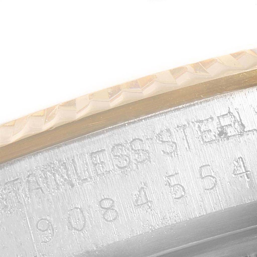 This image shows a close-up of the serial number engraved on the side of a Rolex Vintage Collection 16013 Men's Stainless Steel Champagne Dial 16013 Men's Stainless Steel Champagne Dial watch.