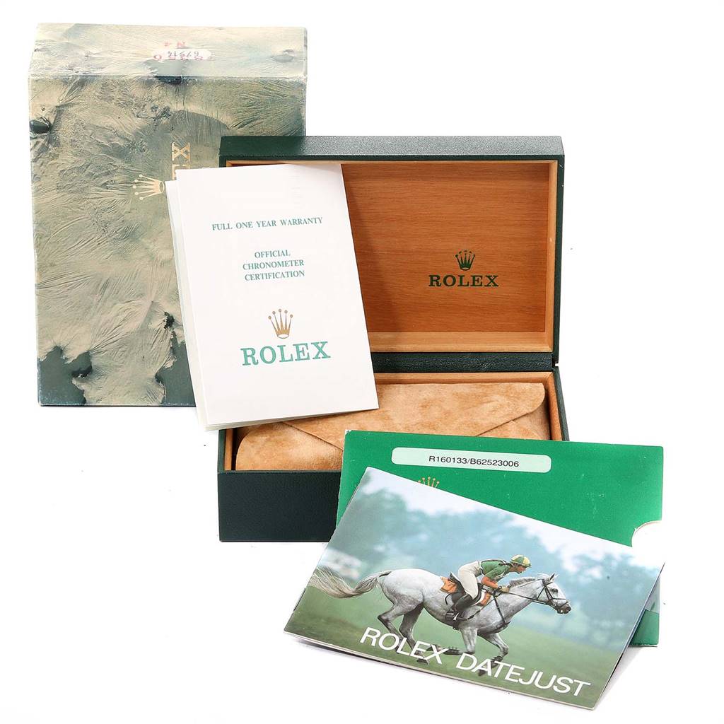 The image shows the packaging and accessories of a Vintage Collection Rolex, including the box, warranty card, and user manuals.