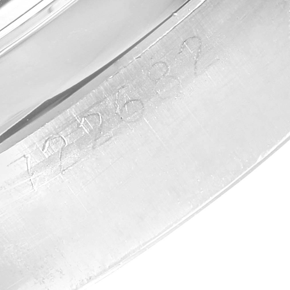 This image shows a close-up of the engraved serial number on the casing of a Rolex Vintage Collection 6694 Men
s Stainless Steel Silver Dial 6694 Men
s Stainless Steel Silver Dial watch.
