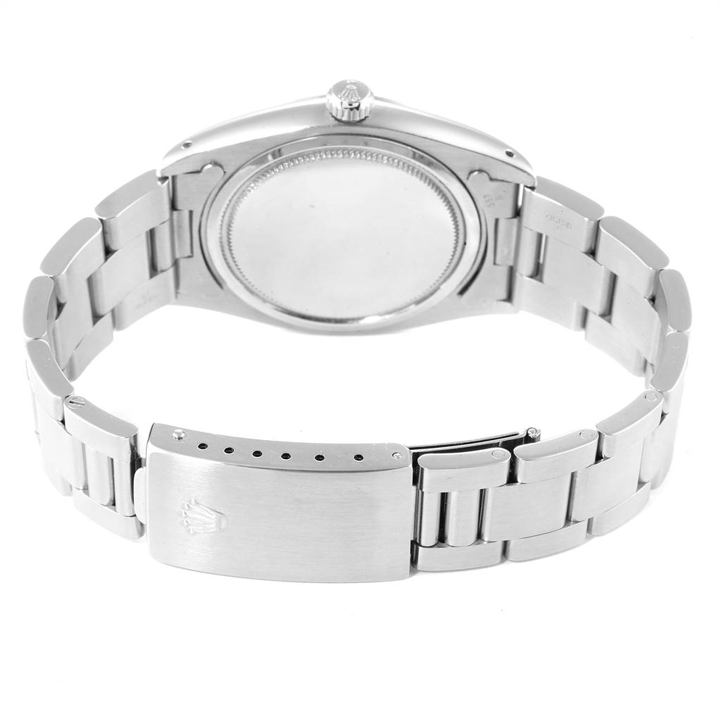 This image shows the back view of a Rolex Vintage Collection 6694 Men
s Stainless Steel Silver Dial 6694 Men
s Stainless Steel Silver Dial watch, showcasing its clasp, bracelet, and case back.