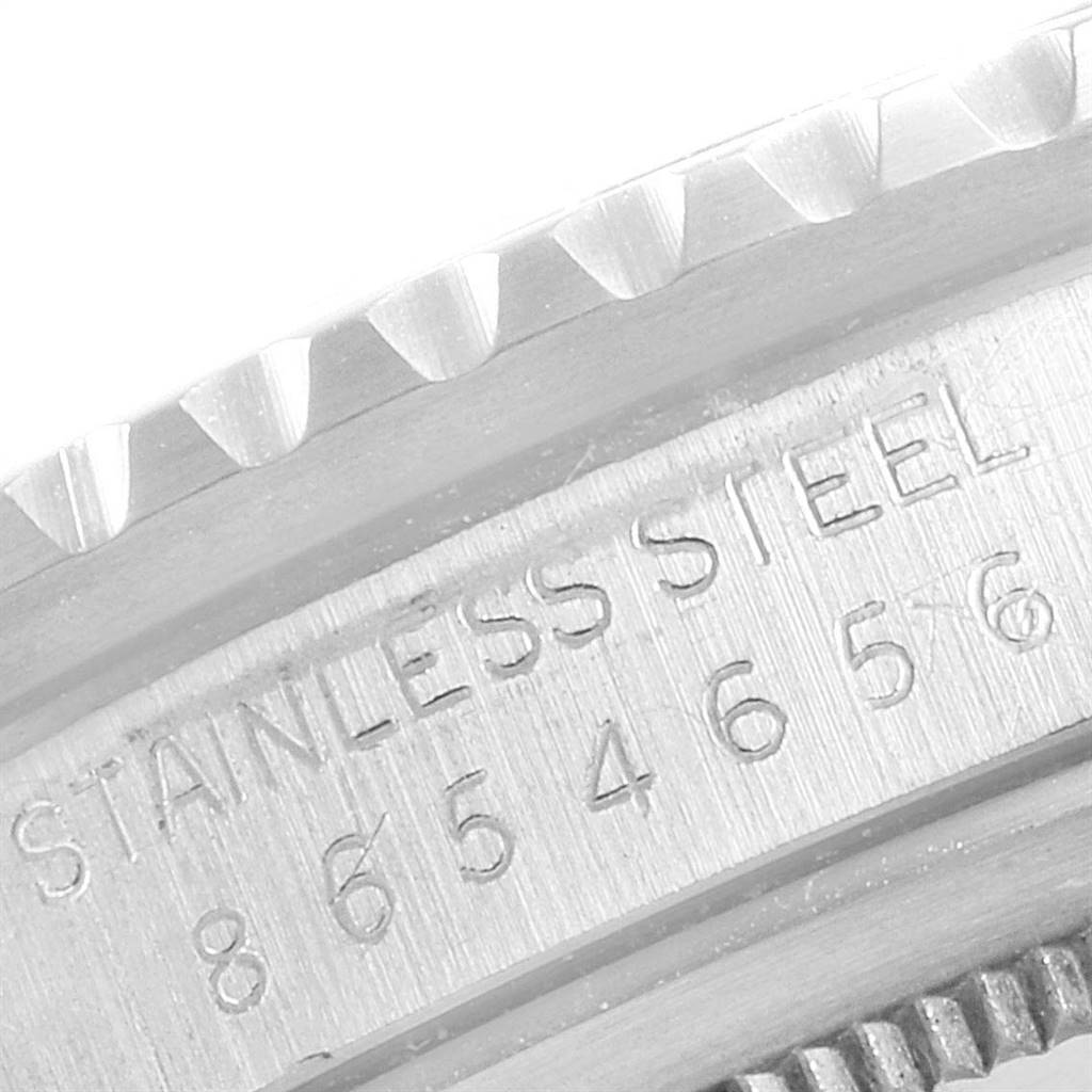 This image shows a close-up angle of the bezel and part of the case with engraving on a Rolex Vintage Collection 16750 Men
s Stainless Steel Black Dial 16750 Men
s Stainless Steel Black Dial watch.