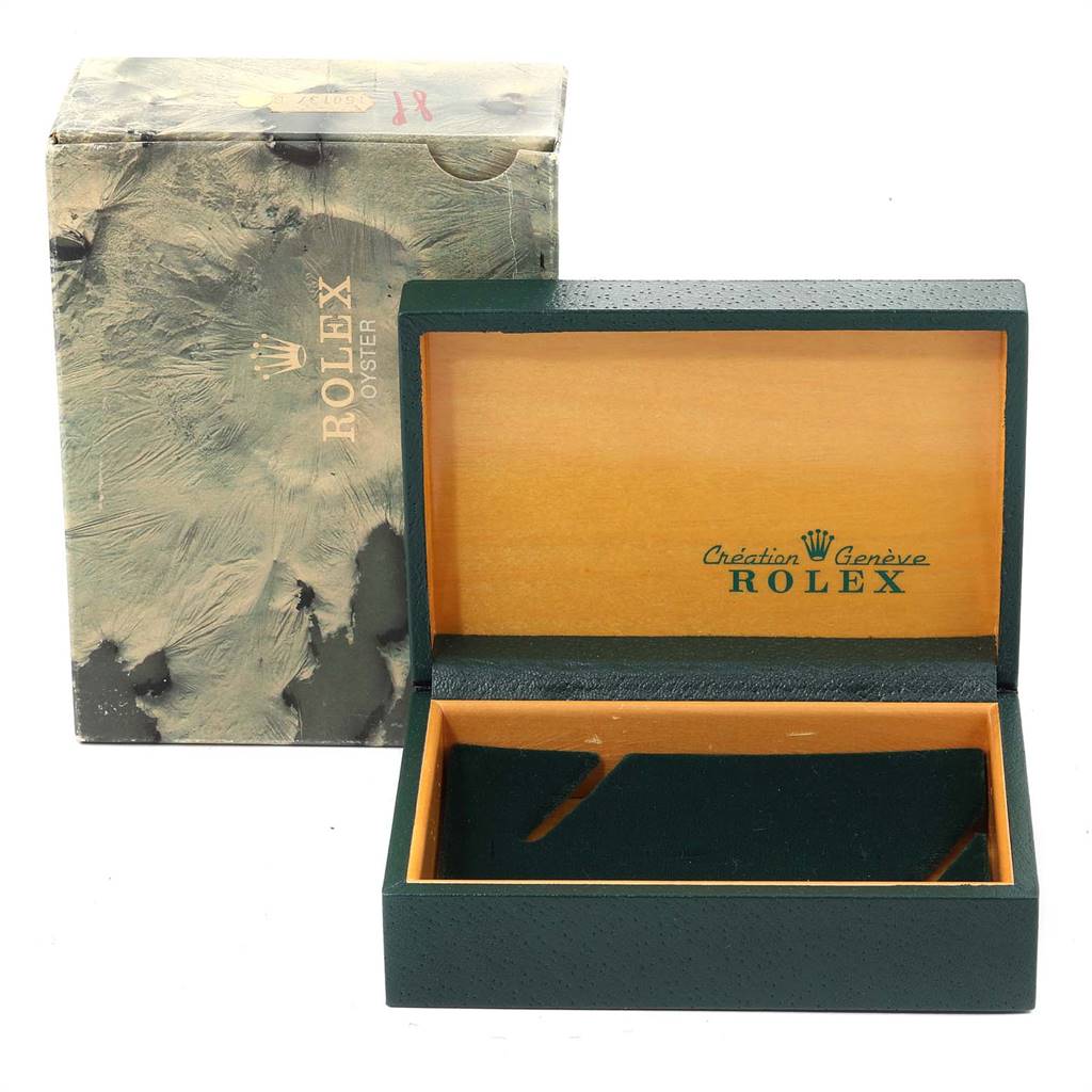 The image shows an open box and outer packaging for a Rolex Vintage Collection 1601 Men
s Stainless Steel Silver Dial 1601 Men
s Stainless Steel Silver Dial watch.