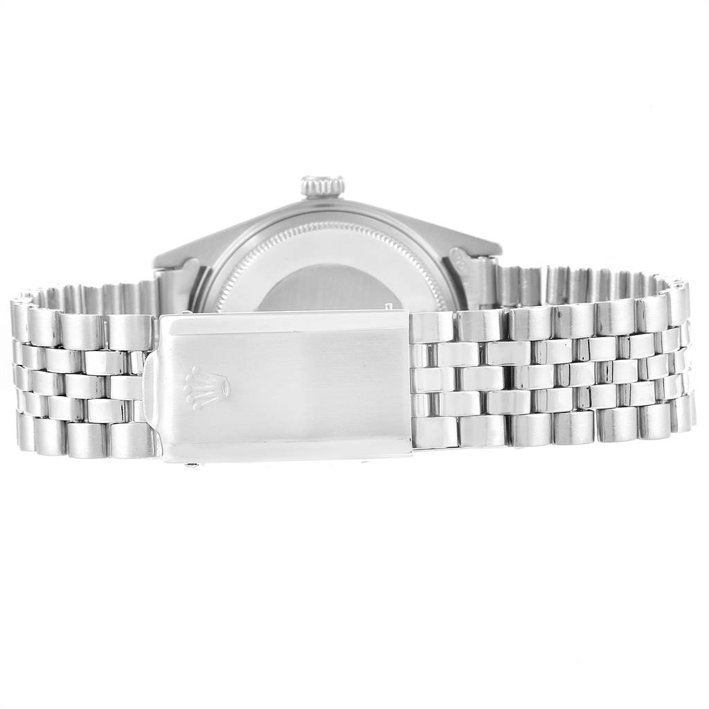 The image shows the back view of a Rolex Vintage Collection 1601 Men
s Stainless Steel Silver Dial 1601 Men
s Stainless Steel Silver Dial watch, highlighting its case back and Jubilee bracelet with the clasp.