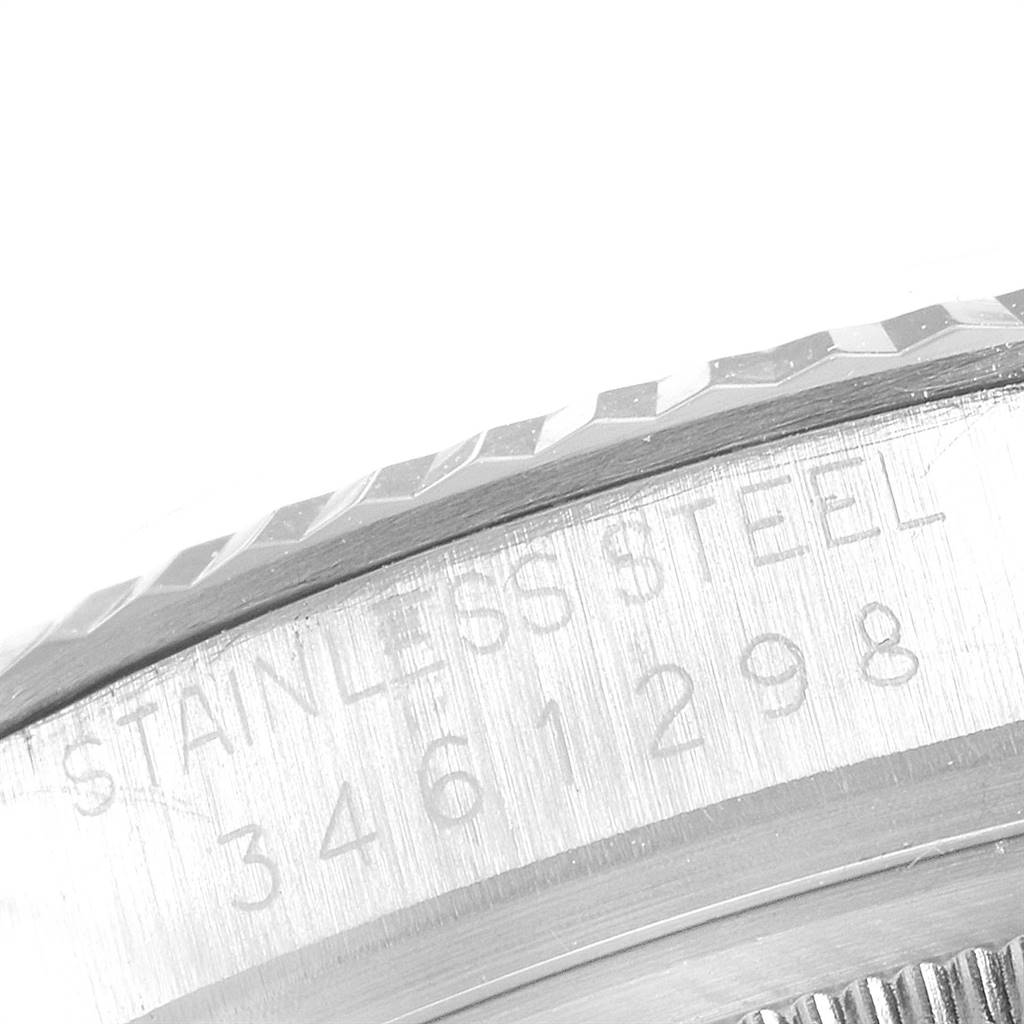 The image shows a close-up of the stainless steel case with engraved details on a Rolex Vintage Collection 1601 Men's Stainless Steel Silver Dial 1601 Men's Stainless Steel Silver Dial watch.