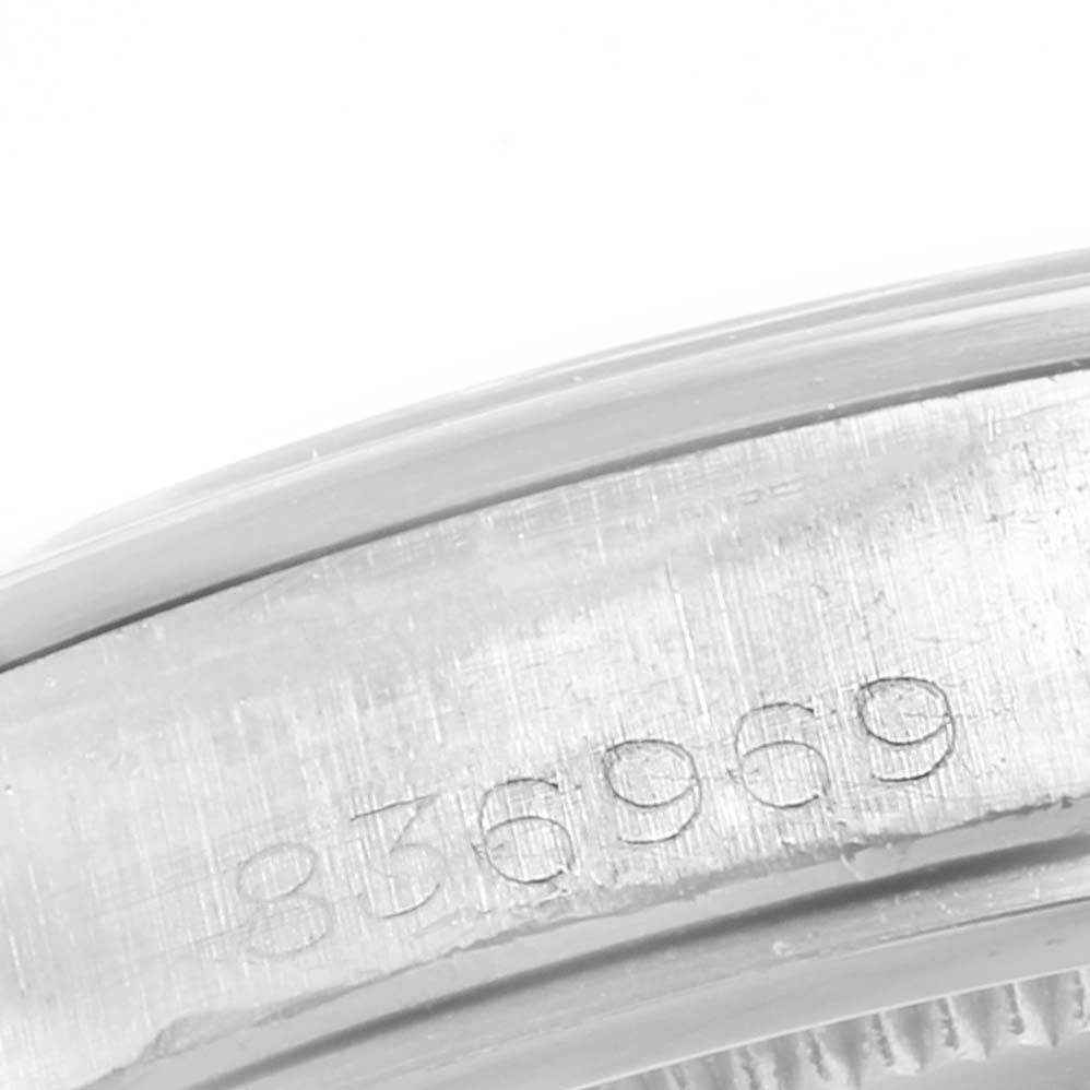 This image shows a close-up of the serial number engraving on the case back edge of a Rolex Vintage Collection 6426 Men
s Stainless Steel Silver Dial 6426 Men
s Stainless Steel Silver Dial watch.