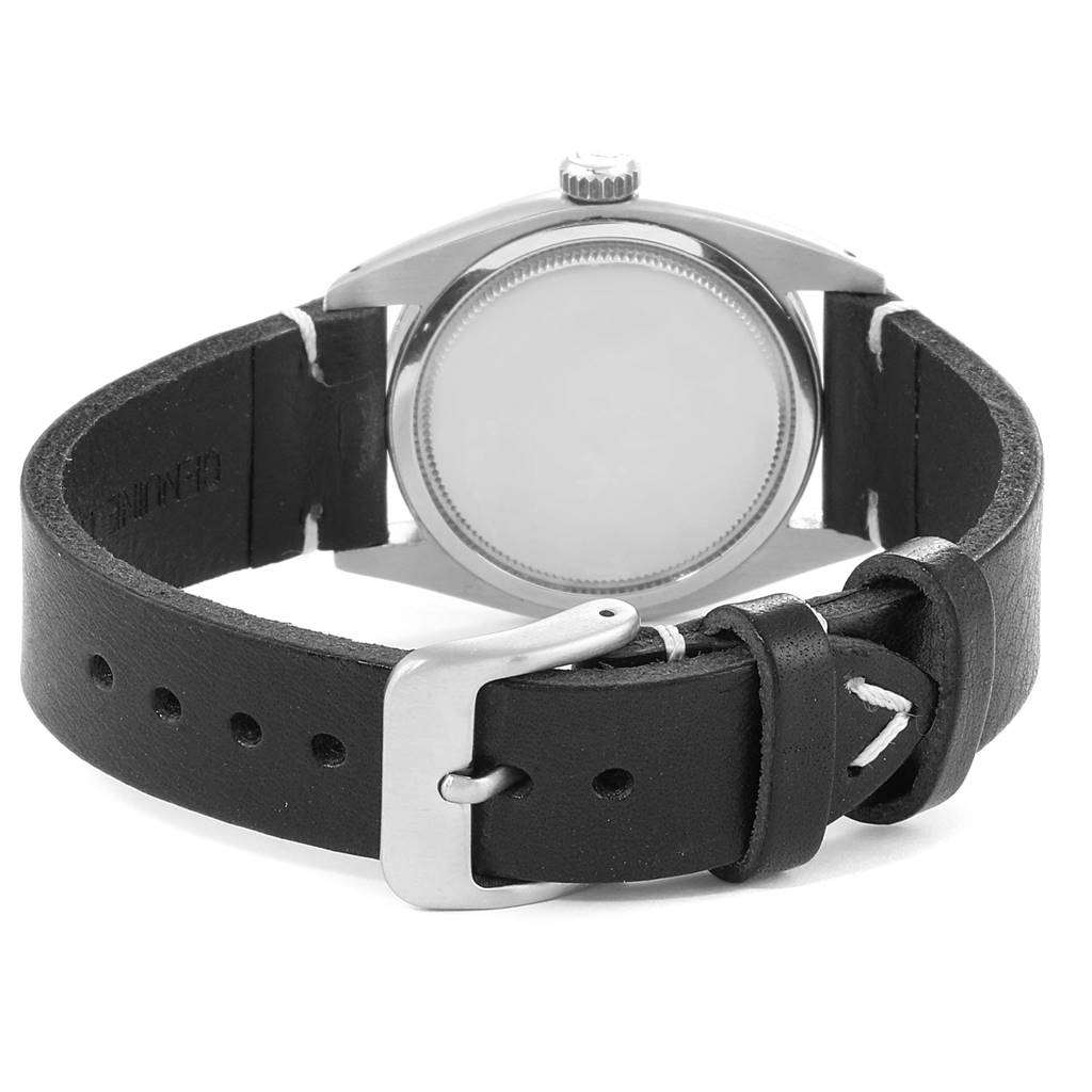 The image shows the back case and leather strap of a Vintage Collection model by Rolex from a rear angle.