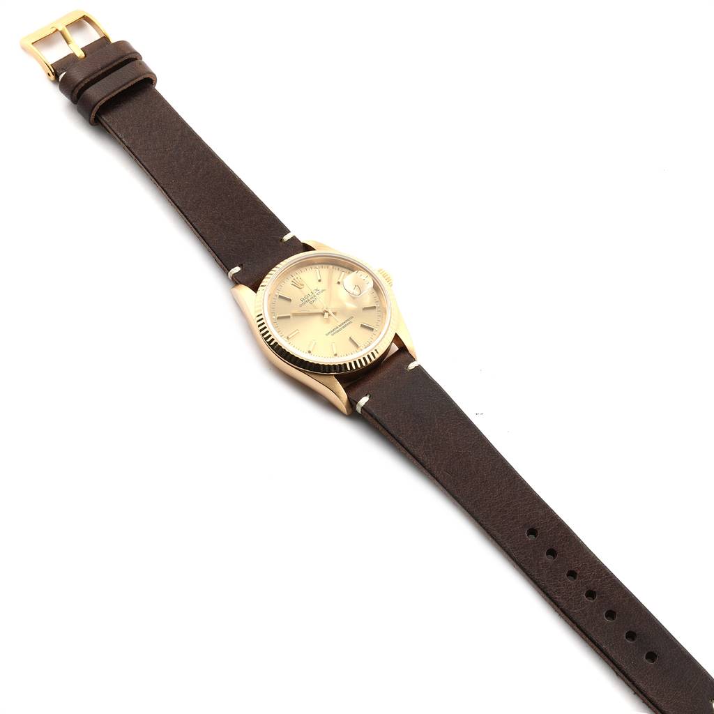 The image shows a Rolex Vintage Collection 15238 Men's Yellow Gold Champagne Dial 15238 Men's Yellow Gold Champagne Dial watch at a slightly angled top view, displaying its dial, case, and brown leather strap.