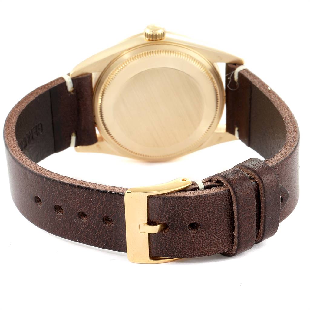 The image shows the back view of a Rolex Vintage Collection 15238 Men's Yellow Gold Champagne Dial 15238 Men's Yellow Gold Champagne Dial watch with a brown leather strap and gold buckle.