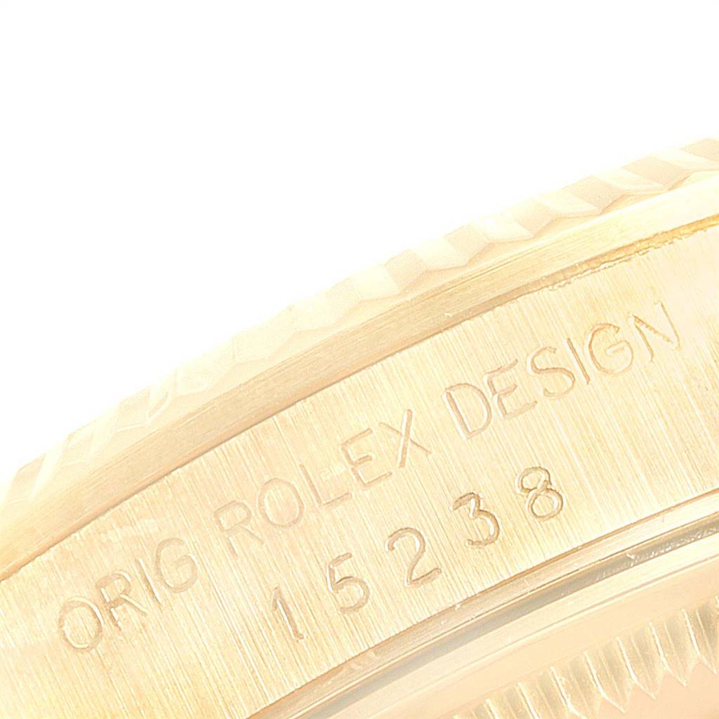 The image shows a close-up of the engraved side of a Vintage Collection Rolex watch, highlighting the model number 15238.